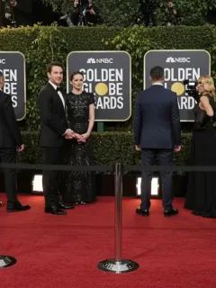 Golden Globes 2026 red carpet with celebrities arriving in glamorous attire.